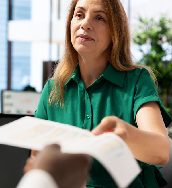 hr-worker-handing-out-contract-man-after-checking-his-qualifications